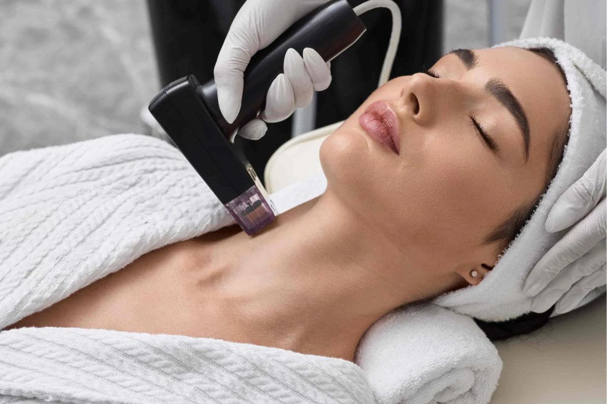 Woman receiving facial skin tightening treatment in Roseville, CA to improve skin firmness and reduce fine lines.